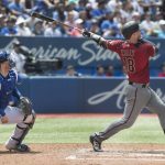 Arizona Diamondbacks' Carson Kelly hits a two-run home run against the Toronto Blue Jays in the third inning of their baseball game in Toronto on Sunday, June 9, 2019. (Fred Thornhill/The Canadian Press via AP)