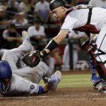 Los Angeles Dodgers' Russell Martin (55) is tagged out at the plate by Arizona Diamondbacks catcher Carson Kelly (18) on a base hit by Hyun-Jin Ryu during the fourth inning of a baseball game, Tuesday, June 4, 2019, in Phoenix. (AP Photo/Matt York)