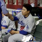 Los Angeles Dodgers starting pitcher Hyun-Jin Ryu sits in the dugout after coming out of the baseball game during the middle of the seventh inning against the Arizona Diamondbacks, Tuesday, June 4, 2019, in Phoenix. (AP Photo/Matt York)