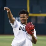 Arizona Cardinals NFL football team rookie quarterback Kyler Murray throws out the first pitch prior to a baseball game between the Arizona Diamondbacks and the Los Angeles Dodgers, Tuesday, June 25, 2019, in Phoenix. (AP Photo/Ross D. Franklin)