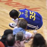 Golden State Warriors forward Kevin Durant (35) goes down with a leg injury against the Toronto Raptors during first half action in Game 5 of the NBA Finals in Toronto on Monday, June 10, 2019. (Frank Gunn/The Canadian Press via AP)