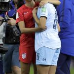 United States' Alex Morgan, left, comforts Thailand's Miranda Nild, right, after the Women's World Cup Group F soccer match between United States and Thailand at the Stade Auguste-Delaune in Reims, France, Tuesday, June 11, 2019. Morgan scored five goals during the match. (AP Photo/Alessandra Tarantino)