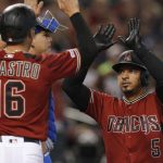 Arizona Diamondbacks' Eduardo Escobar celebrates with Tim Locastro (16) after hitting a two run home run against the New York Mets in the first inning during a baseball game, Sunday, June 2, 2019, in Phoenix. (AP Photo/Rick Scuteri)