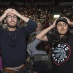 Toronto Raptors fans react during the final seconds of Game 5 in the NBA Finals between the Raptors and Golden State Warriors on a big screen inside the Leon's Centre in Kingston, Ontario, on Monday June 10, 2019. (Lars Hagberg/The Canadian Press via AP)