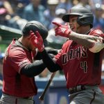 Arizona Diamondbacks' Ketel Marte, right, celebrates his solo home run against the Toronto Blue Jays in the third inning of their baseball game in Toronto on Sunday, June 9, 2019. (Fred Thornhill/The Canadian Press via AP)