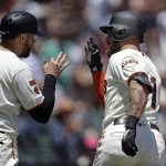 San Francisco Giants' Kevin Pillar, right, celebrates with Evan Longoria (10) after hitting a two-run home run off Arizona Diamondbacks' Robbie Ray in the second inning of a baseball game Sunday, June 30, 2019, in San Francisco. (AP Photo/Ben Margot)