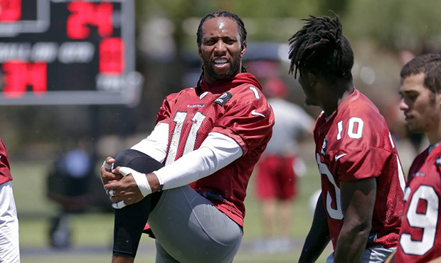 Arizona's Cardinals' Larry Fitzgerald (11) works out during an NFL football organized team activity...