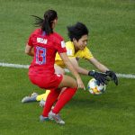 Thailand goalkeeper Waraporn Boonsing take the ball as United States' Alex Morgan runs in during the Women's World Cup Group F soccer match between the USA and Thailand at the Stade Auguste-Delaune in Reims, France, Tuesday, June 11, 2019. (AP Photo/Francois Mori)
