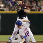 Arizona Diamondbacks' Nick Ahmed forces out New York Mets' Jacob deGrom (48) as he turns a double play on Amed Rosario during the fourth inning of a baseball game Saturday, June 1, 2019, in Phoenix. (AP Photo/Matt York)