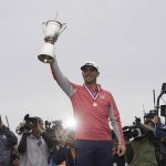 Gary Woodland poses with the trophy after winning the U.S. Open Championship golf tournament Sunday, June 16, 2019, in Pebble Beach, Calif. (AP Photo/Carolyn Kaster)