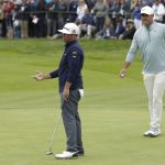 Chez Reavie, left, reacts after missing a putt as Brooks Koepka watches on the 11th hole during the final round of the U.S. Open Championship golf tournament Sunday, June 16, 2019, in Pebble Beach, Calif. (AP Photo/Matt York)