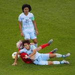 United States' Megan Rapinoe collides with Thailand's Ainon Phancha, right, as Kanjana Sung-Ngoen, top, watches during the Women's World Cup Group F soccer match between the United States and Thailand at the Stade Auguste-Delaune in Reims, France, Tuesday, June 11, 2019. (AP Photo/Francois Mori)
