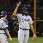 Los Angeles Dodgers relief pitcher Kenley Jansen (74) celebrates with catcher Will Smith after the final out of the team's baseball game against the Arizona Diamondbacks on Tuesday, June 25, 2019, in Phoenix. The Dodgers defeated the Diamondbacks 3-2. (AP Photo/Ross D. Franklin)
