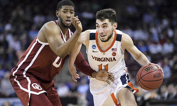 FILE - In this March 24, 2019, file photo, Virginia guard Ty Jerome (11) dribbles the ball as Oklah...