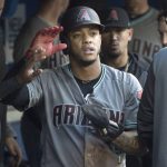 Arizona Diamondbacks' Ketel Marte celebrates in the dugout after scoring in a baseball game against the Toronto Blue Jays, Friday, June 7, 2019, in Toronto. (Fred Thornhill/The Canadian Press via AP)