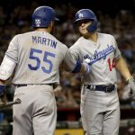 Los Angeles Dodgers' Enrique Hernandez is congratulated by Russell Martin (55) after hitting a solo home run against the Arizona Diamondbacks during the seventh inning of a baseball game Tuesday, June 4, 2019, in Phoenix. (AP Photo/Matt York)