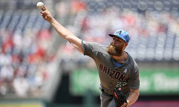 Arizona Diamondbacks starting pitcher Archie Bradley delivers during the first inning of a baseball...