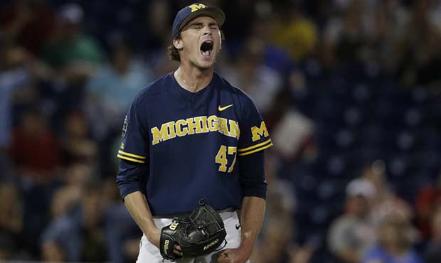 Michigan pitcher Tommy Henry (47) reacts after pitching a complete game against Florida State in an...