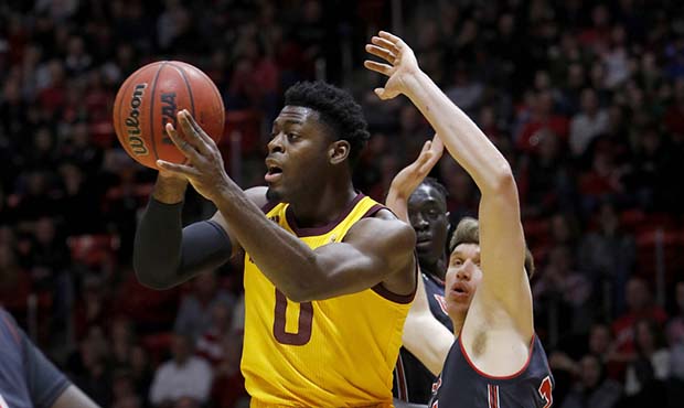 Arizona State's Luguentz Dort (0) looks to pass the ball as Utah's Jayce Johnson, right, defends du...
