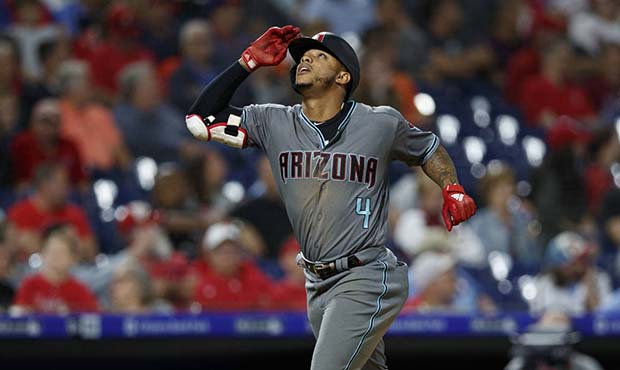 Arizona Diamondbacks' Ketel Marte reacts as he rounds the bases after hitting a home run off Philad...
