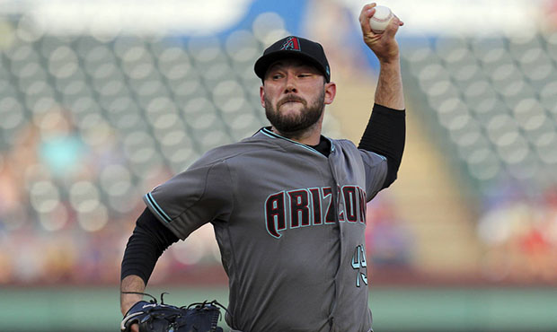 Arizona Diamondbacks starting pitcher Alex Young (49) delivers against the Texas Rangers in the fir...