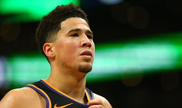 Devin Booker #1 of the Phoenix Suns looks on during the game against the Boston Celtics at TD Garde...