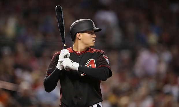 Wilmer Flores #41 of the Arizona Diamondbacks bats against the Boston Red Sox during the MLB game a...