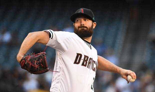 Robbie Ray #38 of the Arizona Diamondbacks delivers a first inning pitch against the Los Angeles Do...