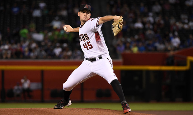 Taylor Clarke #45 of the Arizona Diamondbacks delivers a first inning pitch against the Los Angeles...