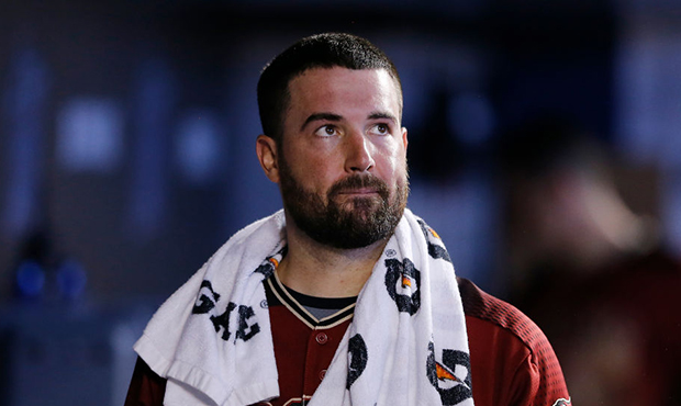 Robbie Ray #38 of the Arizona Diamondbacks looks on in the dugout against the Miami Marlins at Marl...