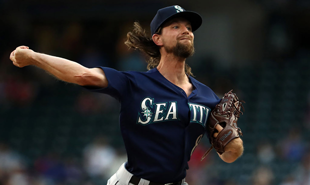 Mike Leake #8 of the Seattle Mariners throws against the Texas Rangers in the first inning at Globe...