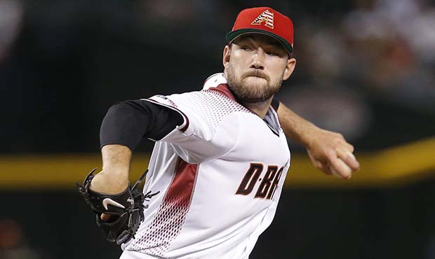 Arizona Diamondbacks pitcher Alex Young throws against the Colorado Rockies in the first inning of ...