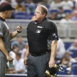 Arizona Diamondbacks manager Torey Lovullo, left, argues with Home Plate umpire Bruce Dreckman when the benches cleared after Christian Walker was hit by a pitch during the eighth inning of a baseball game against the Miami Marlins, Saturday, July 27, 2019, in Miami. (AP Photo/Wilfredo Lee)