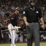 Home plate umpire Manny Gonzalez, right, walks away as Arizona Diamondbacks Christian Walker, left, yells at him after being called out on strikes during the eighth inning of a baseball game against the Milwaukee Brewers, Saturday, July 20, 2019, in Phoenix. (AP Photo/Matt York)