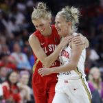 Chicago Sky's Allie Quigley, of Team Wilson, left, embraces Chicago Sky's Courtney Vandersloot, of Team Delle Donne, during the second half of a WNBA All-Star basketball game Saturday, July 27, 2019, in Las Vegas. (AP Photo/John Locher)