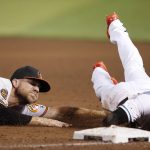 Baltimore Orioles first baseman Chris Davis, left, tags out Arizona Diamondbacks' Jarrod Dyson for a double play during the fifth inning of a baseball game, Tuesday, July 23, 2019, in Phoenix. (AP Photo/Ross D. Franklin)