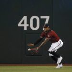Arizona Diamondbacks center fielder Ketel Marte makes a running catch on a ball hit by Milwaukee Brewers' Lorenzo Cain during the first inning of a baseball game Sunday, July 21, 2019, in Phoenix. (AP Photo/Ross D. Franklin)
