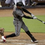 Arizona Diamondbacks' Wilmer Flores hits an RBI-double to score Adam Jones during the fourth inning of a baseball game against the Miami Marlins, Monday, July 29, 2019, in Miami. (AP Photo/Lynne Sladky)