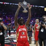 Indiana Fever's Erica Wheeler, of Team Wilson, holds up the MVP trophy after winning the honor at the WNBA All-Star basketball game Saturday, July 27, 2019, in Las Vegas. (AP Photo/John Locher)
