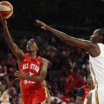 Indiana Fever's Erica Wheeler, of Team Wilson, shoots around New York Liberty's Tina Charles, of Team Delle Donne, during the second half of a WNBA All-Star basketball game Saturday, July 27, 2019, in Las Vegas. (AP Photo/John Locher)