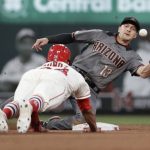 St. Louis Cardinals' Yairo Munoz is out trying to steal second as Arizona Diamondbacks shortstop Nick Ahmed (13) handles the throw during the sixth inning of a baseball game Saturday, July 13, 2019, in St. Louis. (AP Photo/Jeff Roberson)