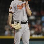 Baltimore Orioles relief pitcher Tanner Scott looks down after walking in a run against the Arizona Diamondbacks during the seventh inning of a baseball game, Wednesday, July 24, 2019, in Phoenix. (AP Photo/Matt York)