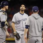 Milwaukee Brewers starting pitcher Gio Gonzalez, center, looks away as manager Craig Counsel, right, pulls him from the game during the fifth inning of a baseball game against the Arizona Diamondbacks, Saturday, July 20, 2019, in Phoenix. At left is catcher Yasmani Grandal. (AP Photo/Matt York)