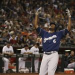 Milwaukee Brewers' Lorenzo Cain celebrates his home run against the Arizona Diamondbacks during the third inning of a baseball game Friday, July 19, 2019, in Phoenix. (AP Photo/Ross D. Franklin)