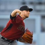 Arizona Diamondbacks starting pitcher Merrill Kelly throws during the first inning of the team's baseball game against the Arizona Diamondbacks on Wednesday, July 3, 2019, in Los Angeles. (AP Photo/Mark J. Terrill)