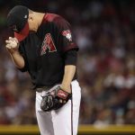 Arizona Diamondbacks starting pitcher Zack Greinke adjusts his cap after giving up a run against the Milwaukee Brewers during the fourth inning of a baseball game, Saturday, July 20, 2019, in Phoenix. (AP Photo/Matt York)