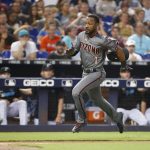 Arizona Diamondbacks' Jarrod Dyson heads for home to score on a single by Eduardo Escobar during the fourth inning of a baseball game against the Miami Marlins, Saturday, July 27, 2019, in Miami. (AP Photo/Wilfredo Lee)