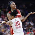 Washington Mystics' Kristi Toliver, of Team Delle Donne, jokingly guards Las Vegas Aces' Liz Cambage, of Team Wilson, during the second half of a WNBA All-Star basketball game Saturday, July 27, 2019, in Las Vegas. (AP Photo/John Locher)