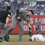 Arizona Diamondbacks shortstop Nick Ahmed, center, tags out New York Yankees' Gio Urshela at second base during the second inning of a baseball game Tuesday, July 30, 2019, in New York. (AP Photo/Frank Franklin II)