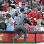 Arizona Diamondbacks third baseman Jake Lamb is unable to catch a foul ball by St. Louis Cardinals' Kolten Wong during the first inning of a baseball game Saturday, July 13, 2019, in St. Louis. (AP Photo/Jeff Roberson)